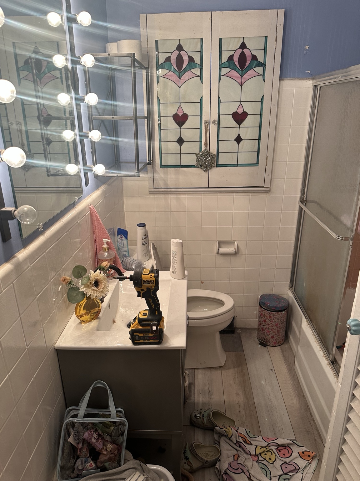 Bathroom vanity and tile before remodeling work