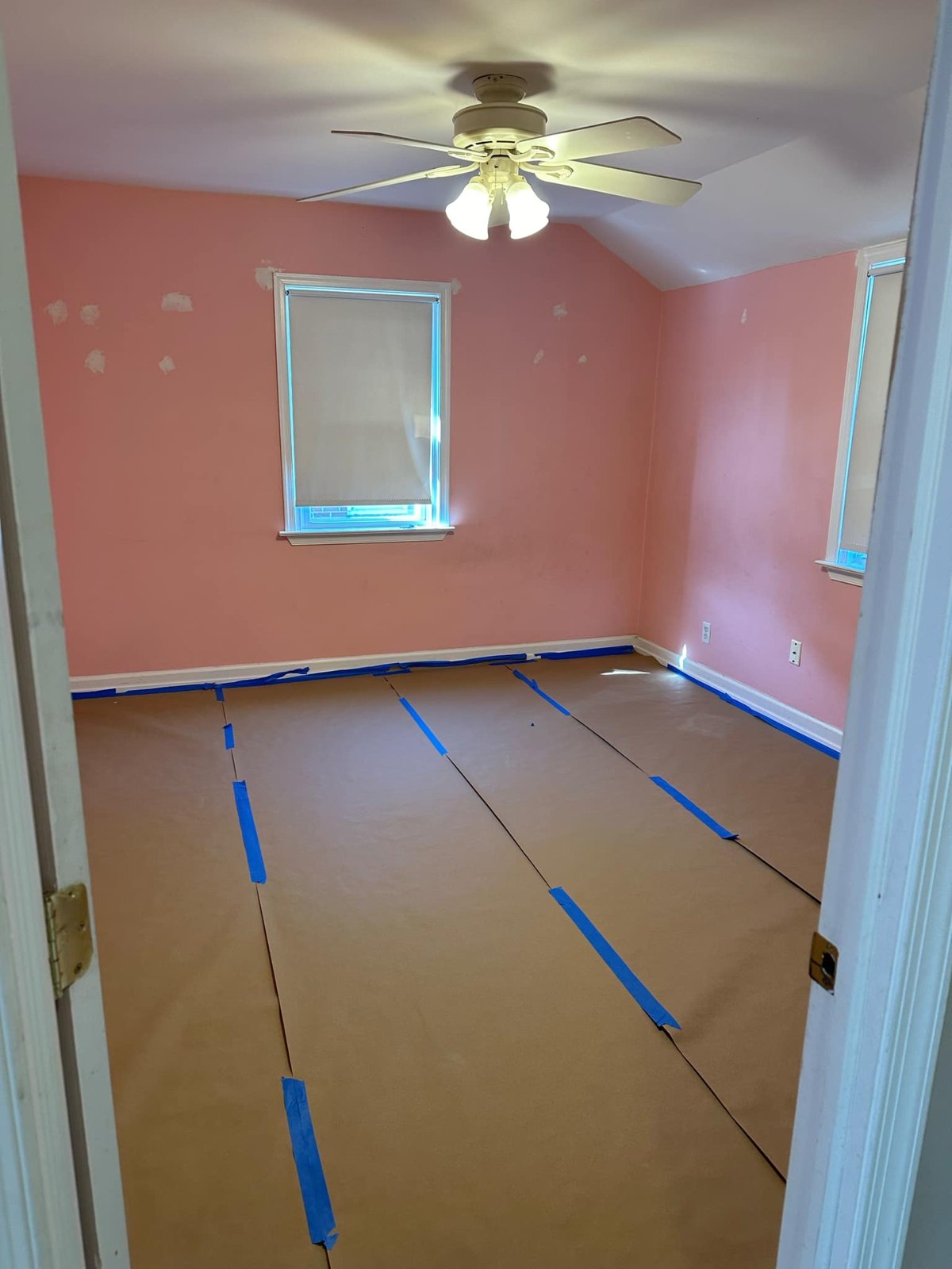 Bedroom painting prep with protected floors and trim