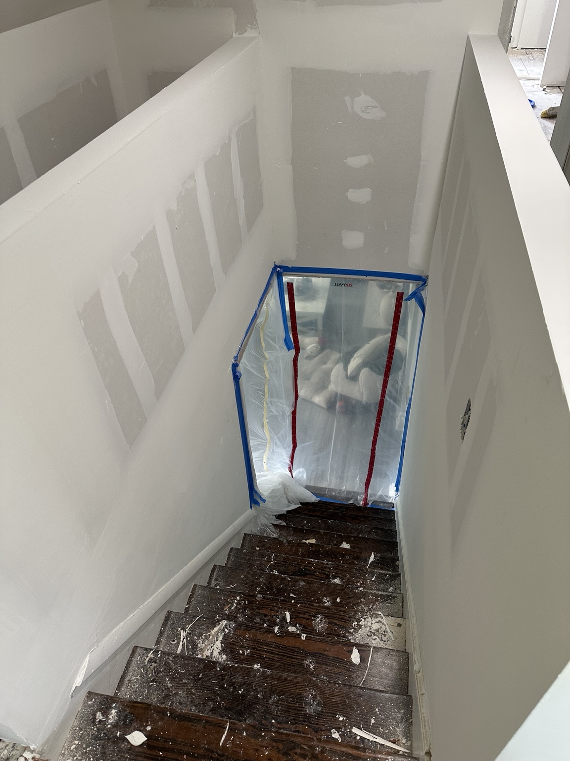 Close-up drywall patch and compound repair